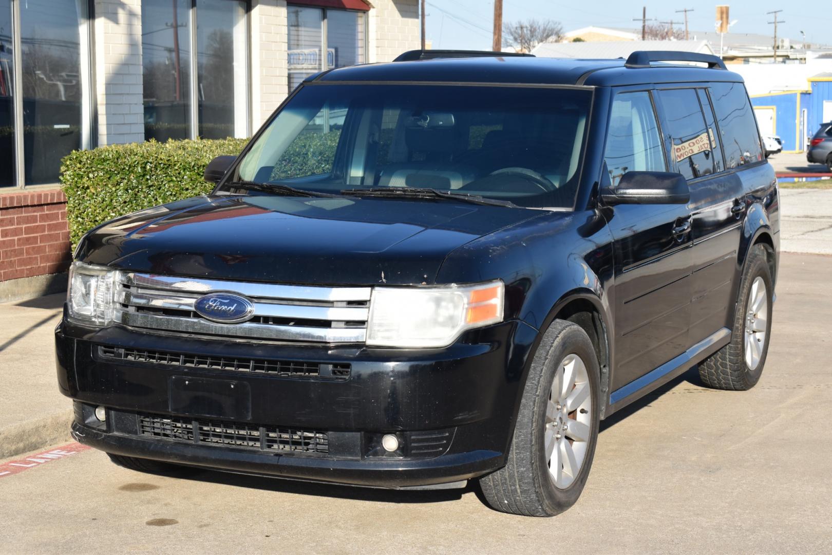2009 Black /Gray Ford FLEX (2FMDK51C19B) with an V6, 3.5L engine, AUTOMATIC transmission, located at 5925 E. BELKNAP ST., HALTOM CITY, TX, 76117, (817) 834-4222, 32.803799, -97.259003 - Purchasing a 2009 Ford Flex can be a great decision for several reasons: Spacious and Versatile Interior: The Ford Flex is known for its spacious and comfortable interior, offering seating for up to seven passengers across three rows. The boxy design maximizes interior space, providing ample headro - Photo#1